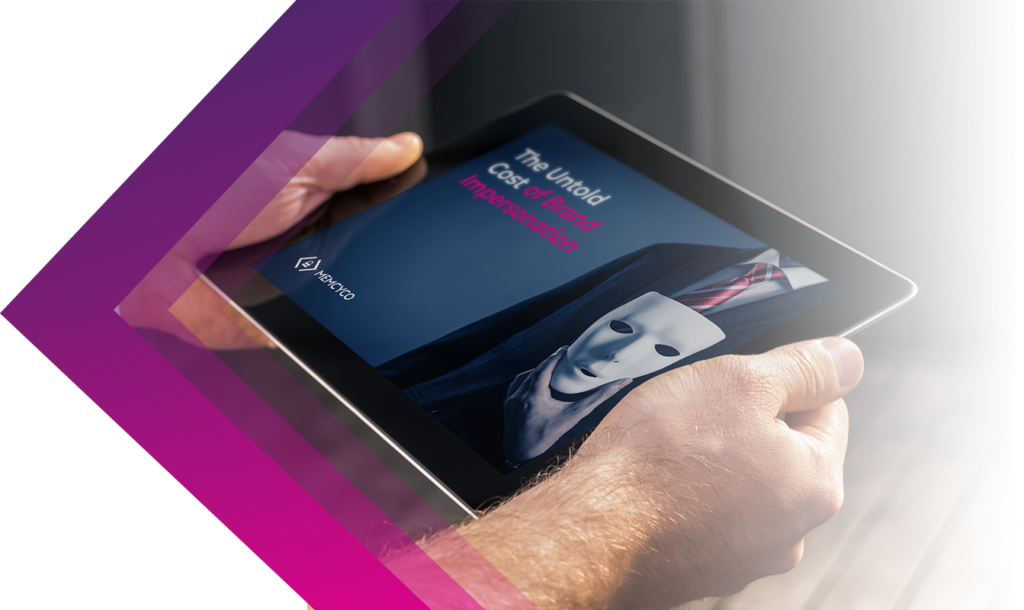 A person holds a tablet displaying an image of a suited figure with a white mask, highlighting the untold cost of brand impersonation and emphasizing the risks businesses face from this growing threat.